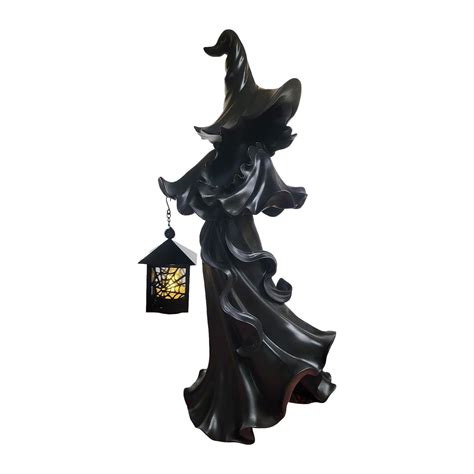 Light up your Halloween with a witch holding a lantern design from Cracker Barrel